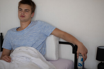 Young man waking up and reaching for a water bottle — healthy morning habit. _Morning Thoughts...