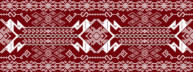 Traditional textile pattern with geometric shapes in white on a deep red background, featuring symmetrical designs and intricate motifs.