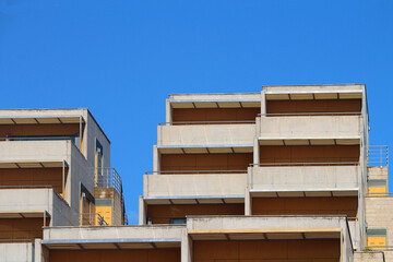 Multi-storey apartment building with large balconies against blue sky (Tenerife, Spain)