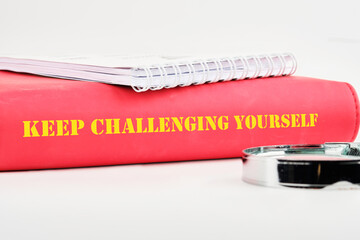 Personal growth concept. Words KEEP CHALLENGING YOURSELF