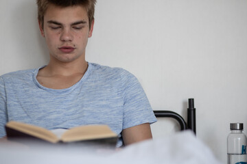 Teenager relaxing with a book. _Morning Thoughts Collection