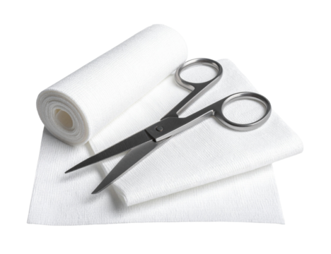 Sharp stainless steel bandage scissors are lying on a piece of white gauze near a roll of medical bandage, isolated on a transparent background, ready for use in first aid or medical procedures