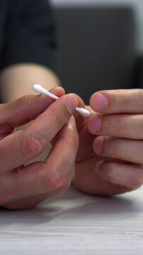 Ear stick in hands.
Cotton swab close-up.
Hygiene of auricles and dirt and microbes.
Ear, stick, white, sponge, ear stick
