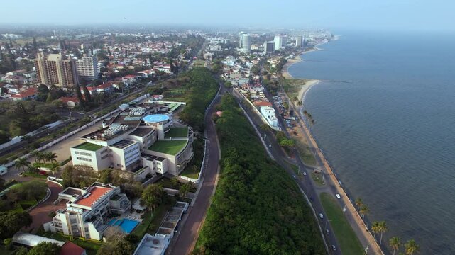Sweeping aerial pullback from Maputo&rsquo;s Twin Towers reveals the Somershield coast and city skyline of Mozambique