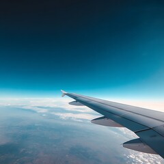 Fototapeta premium close-up of an airplane wing in mid-flight, clear blue sky, ample copy space, more clarity with clear light and sharp focus, high detailed .