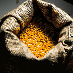 Yellow Lentils in Burlap Sack on Wooden Background

