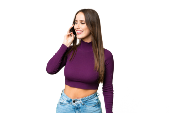 Young beautiful woman over isolated chroma key background keeping a conversation with the mobile phone