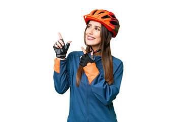 Young cyclist woman over isolated chroma key background pointing with the index finger a great idea
