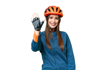 Young cyclist woman over isolated chroma key background counting five with fingers