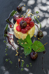 mascarpone cherry tartlet served on a slate plate