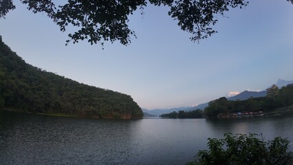 Tranquil Early Morning at Pokhara Lake: Serene Mountains and Calm Waters