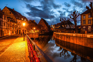 Eguisteim canals with typical houses at dusk