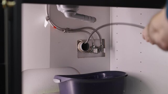 Plumber drill through clogged sink pipes with spring tube tool 4K