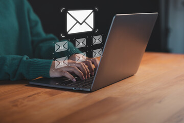 Person typing on a laptop with sending online message and email icon, representing digital communication, online messaging, internet network remote work and secure email technology.