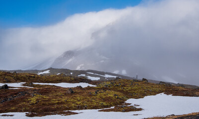 Icelandic landscape with mountains and meadow land covered in snow at snaefellsnes peninsula in...