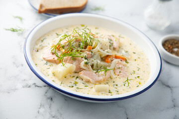 Salmon soup with cream and dill