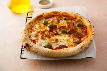 Traditional pizza with olives and cheese