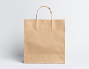 Simple brown paper shopping bag with handles on a white background