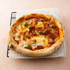 Traditional pizza with olives and cheese