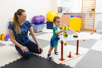 Handrails for restoring walking skills will help in rehabilitation of child. Modern physical...