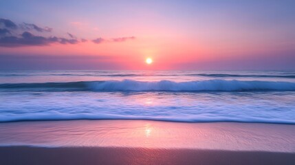 Obraz premium Gentle waves washing over a sandy beach during a breathtaking golden sunrise, creating a serene and idyllic coastal scene