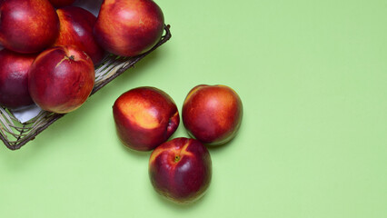 Zenith view, nectarine on green background.