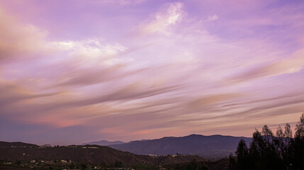 Pale lilac tinted clouds at sunset in tropical Broome,are beautifully hued with soft pink and lavender tones.