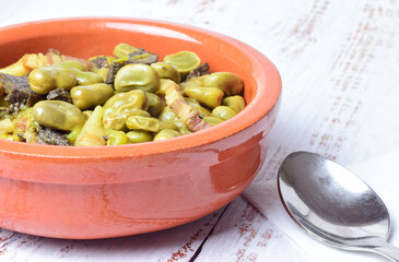 Close up. Baby broad beans with bacon and black pudding, typical of Spain.