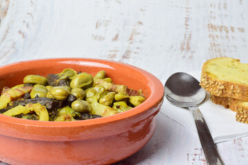 Baby broad beans with bacon and black pudding, typical of Spain.