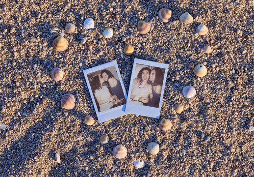Vertical Beach Instant Photos surrounded by some heart-shaped stones