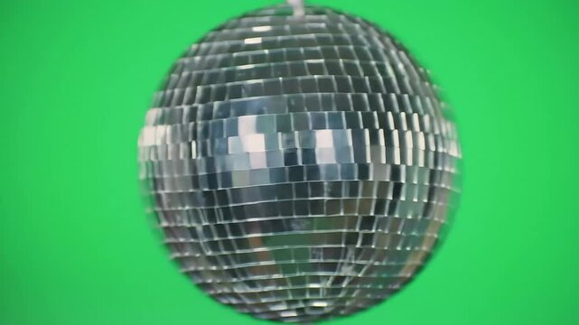 Single disco ball, centered on green screen (#00FF00), isolated with mirror reflections, no other elements, retro party symbol.

