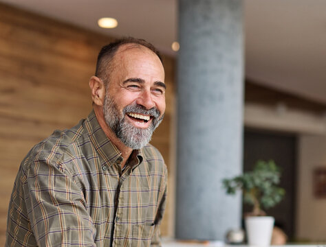 Group of businesspeople having a meeting shaking hands handshake introducing each other and applauding during meeting in the office. Teamwork and success concept, portrait of a middle aged mature bus - Powered by Adobe