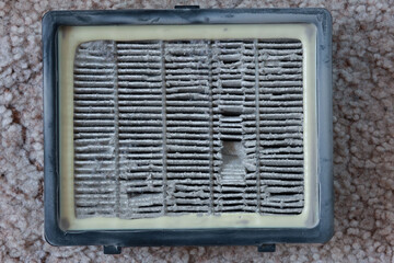 Close Up Top View Of A Very Dirty And Clogged Rectangular Air Filter From A Vacuum Cleaner, Showing...