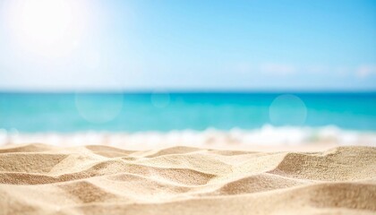 Obraz premium Beautiful summer background with a sandy beach and blue sea water, close up and blurred, copy space concept. Summer vacation banner template design for travel or decoration background 