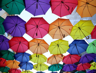 Vibrant Umbrella Canopy - A Kaleidoscope of Colors and Patterns Overhead. A display of countless...