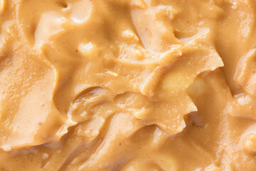 Closeup view of tasty peanut butter. Sweet organic eco food