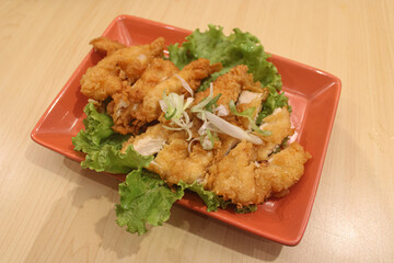 Crispy Japanese Karaage Fried Chicken with Fresh Lettuce and Scallions