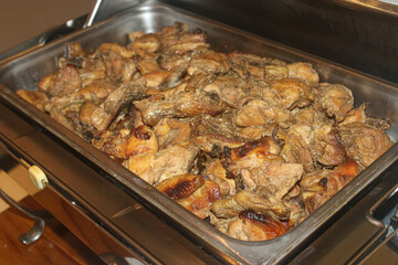 Savory Indonesian Grilled or Braised Chicken Pieces in a Warming Tray