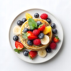 Freshly prepared healthy chia seed pancakes are topped with vibrant fresh fruit offe a visually appealing and delicious breakfast or brunch meal on a plate.