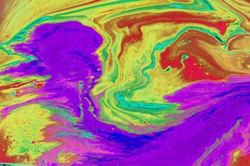 Abstract multicolored background. The colors mix freely and create a wave of movement. Bright...