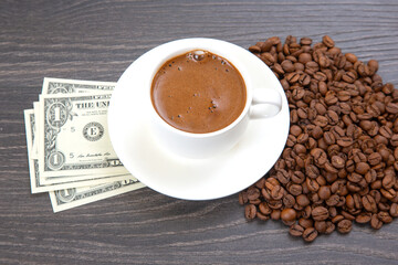 Enjoying a rich cup of coffee with fresh beans and a touch of cash on a wooden table. coffee business