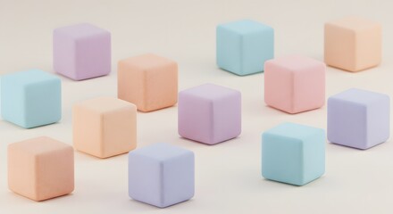 Fototapeta premium A pastel assortment of cubes scattered on a light surface creating a soft and playful composition