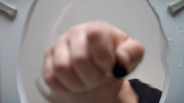 The wireless earbuds slipped into the toilet, and the man swiftly retrieved them from the bowl. It was an embarrassing situation