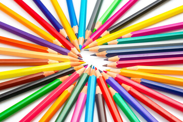 A dynamic array of multicolored pencils radiating outward on a white background, creating a...
