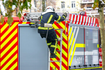 firefighter man works on his fire truck. fire safety service