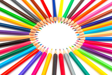 A circle of colorful pencils radiating outward on a white background, creating a vibrant frame....