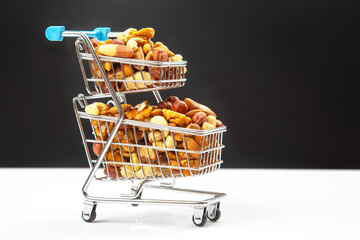 Various types of nuts in the grocery cart. Marketing sale of food products. Vitamin organic protein...
