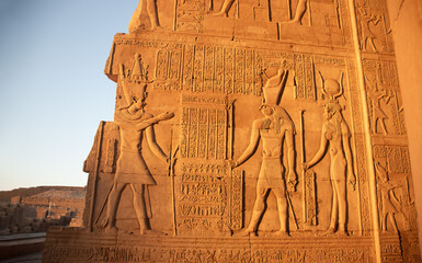 Ancient egyptian carvings on the walls of Kom Ombo temple in Aswan, Egypt