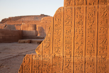 Ancient egyptian hieroglyphs carved on the walls of Kom Ombo temple in Aswan, Egypt
