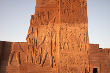 Ancient egyptian carvings on the walls of Kom Ombo temple in Aswan, Egypt